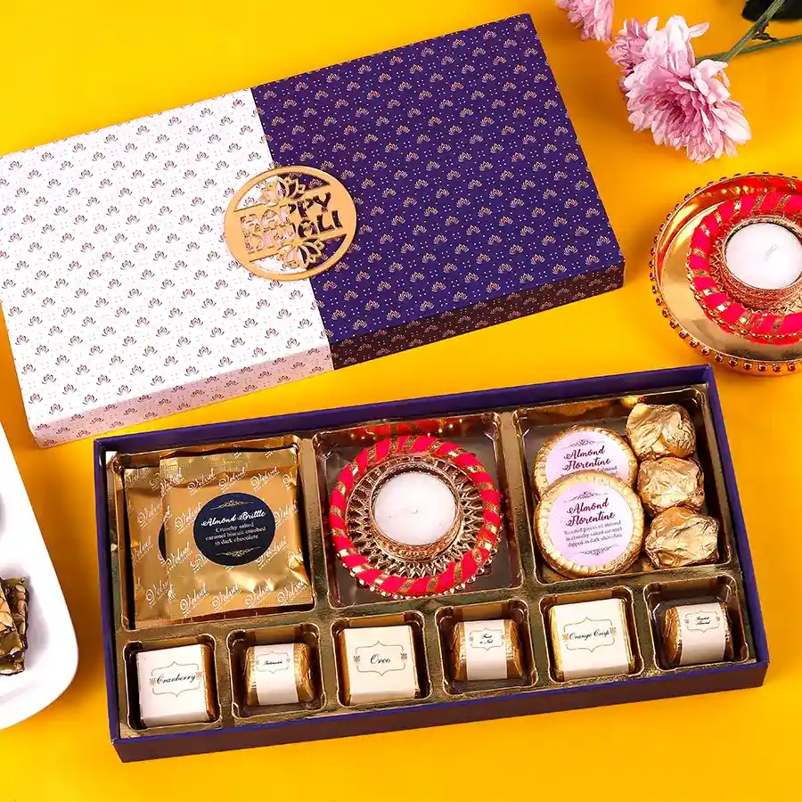 Variety Box Chocolates and Diya with assorted chocolates and a decorative diya