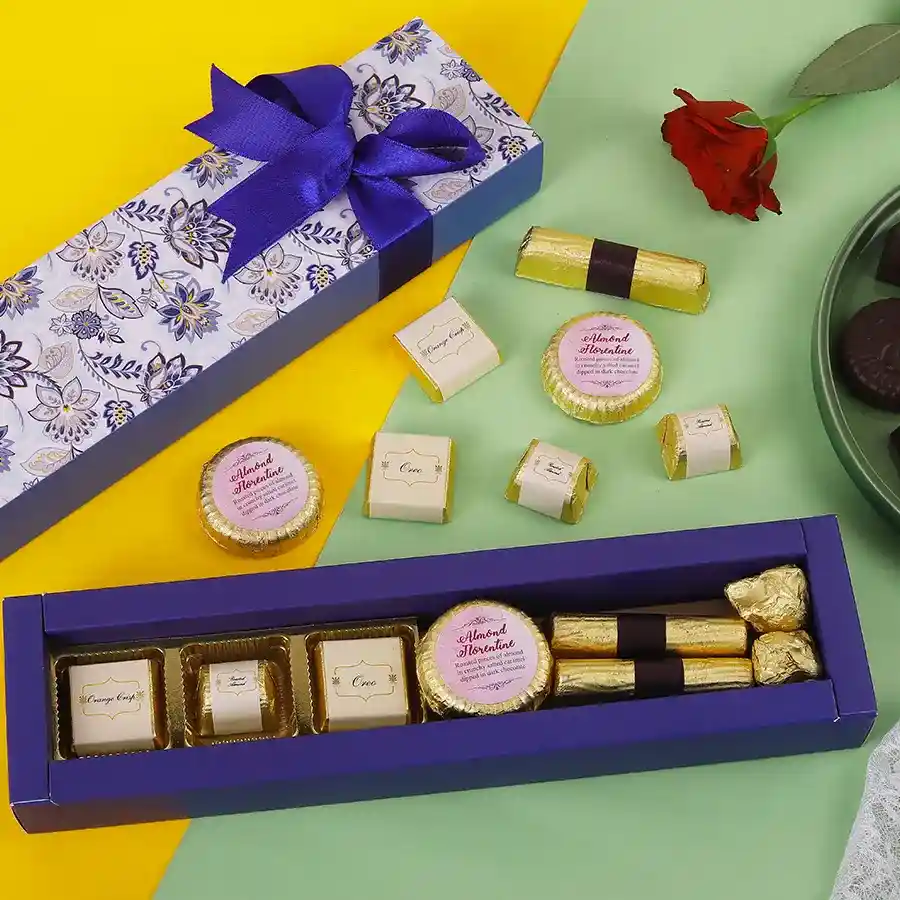 Assorted Sweet Delight Box featuring handcrafted chocolates, almond chocolate florentines, granola logs, and almond chocolate rocks.