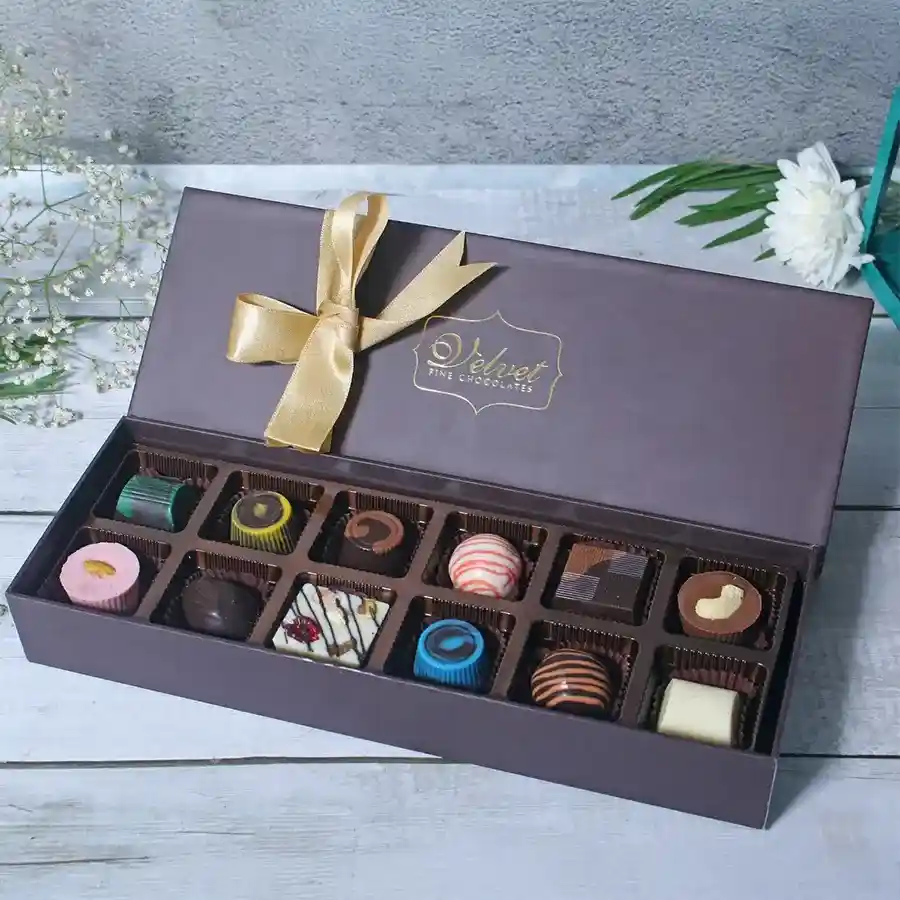 Merry Celebrations Chocolates Hamper featuring an assortment of 12 chocolate flavors in an elegant package