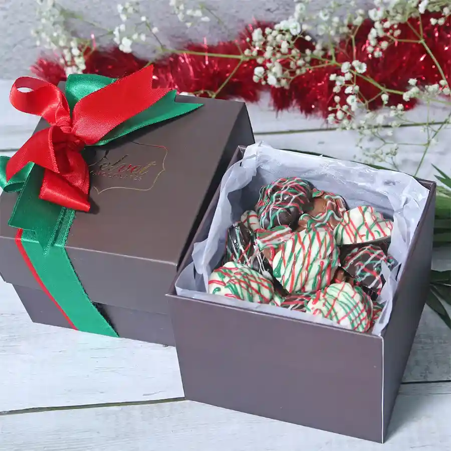 Soulful Chocolate Almond Rocks Treat in a festive gift box with Christmas-themed decorations