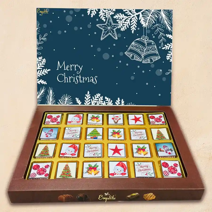 Merry N Bright Chocolaty Assortment box featuring 24 assorted chocolates with Christmas-themed decorations and flavors like roasted dry fruit, cranberry, paan, butterscotch, mixed fruits, and chocochip.