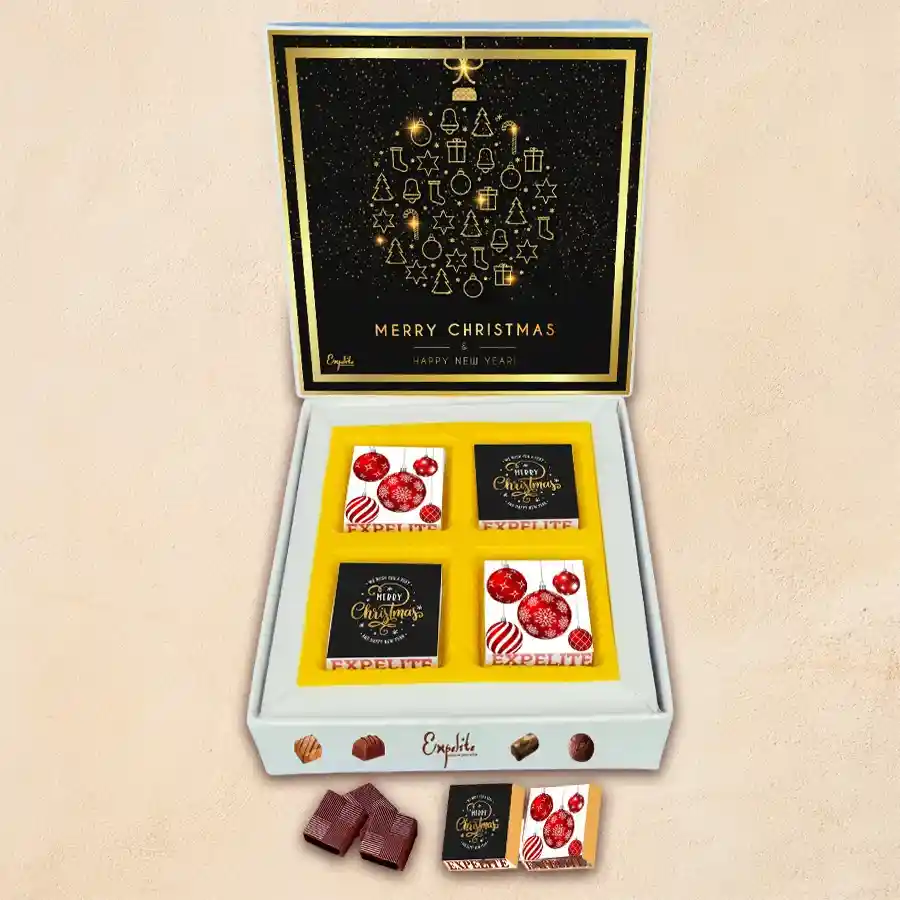 Christmas and New Year chocolate gift box featuring four unique chocolates with different fillings, wrapped in a festive box with holiday designs.