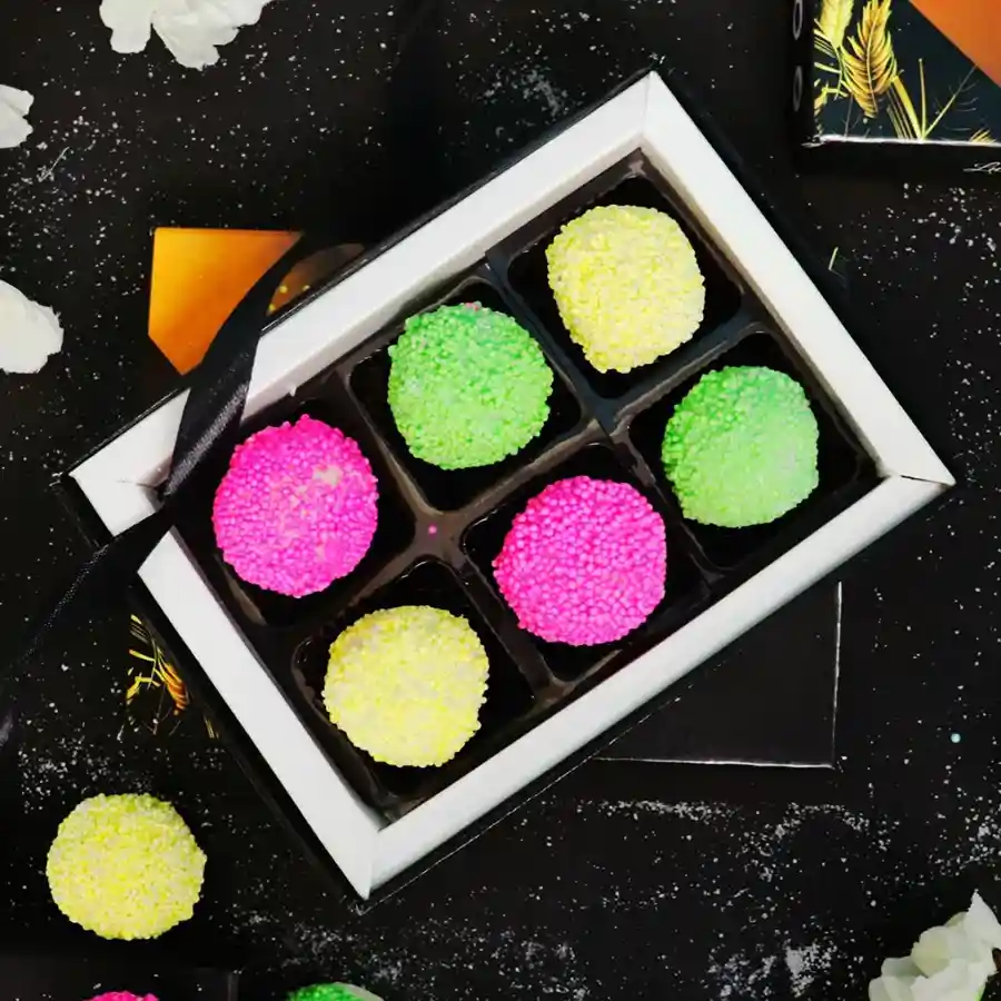 Irresistible Chocolate Truffle Assortment Box featuring six decadent truffles with creamy coconut centers in rich chocolate.