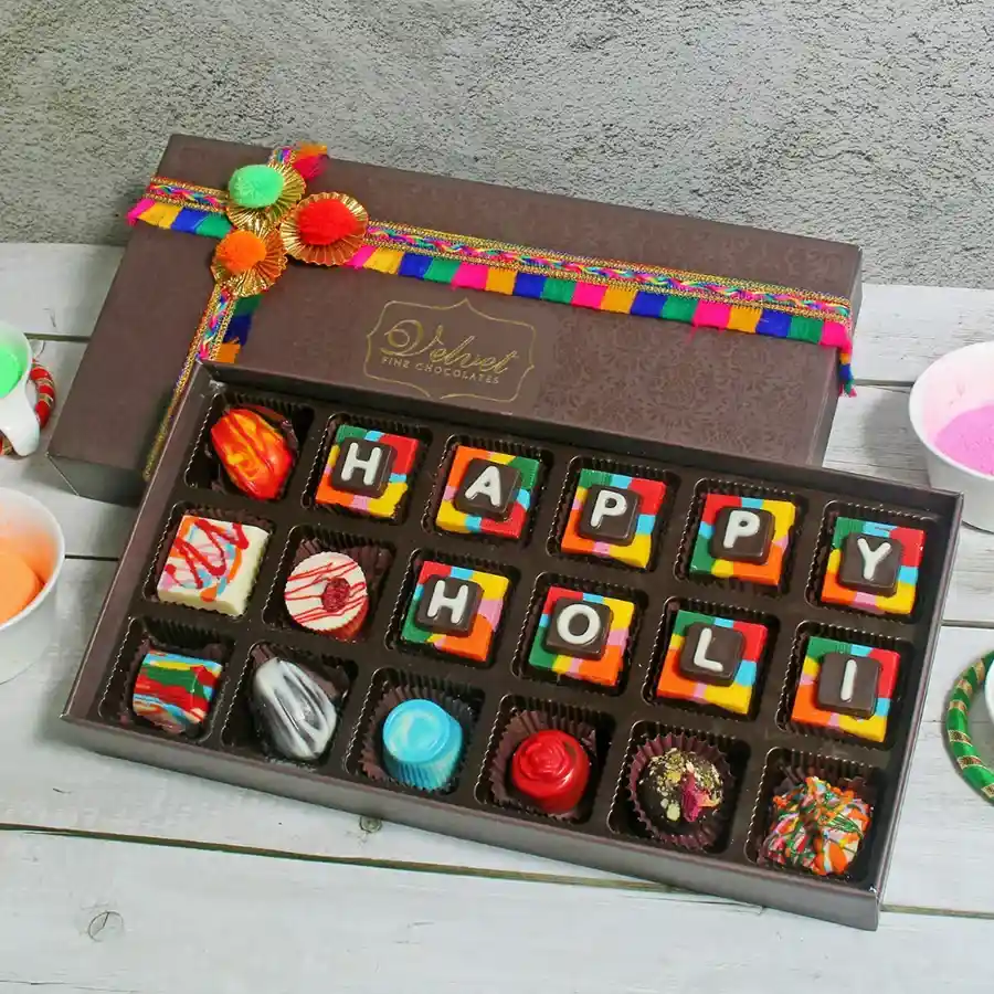 Elegant box filled with 18 handcrafted premium chocolates including truffles and pralines, showcasing a festive design.