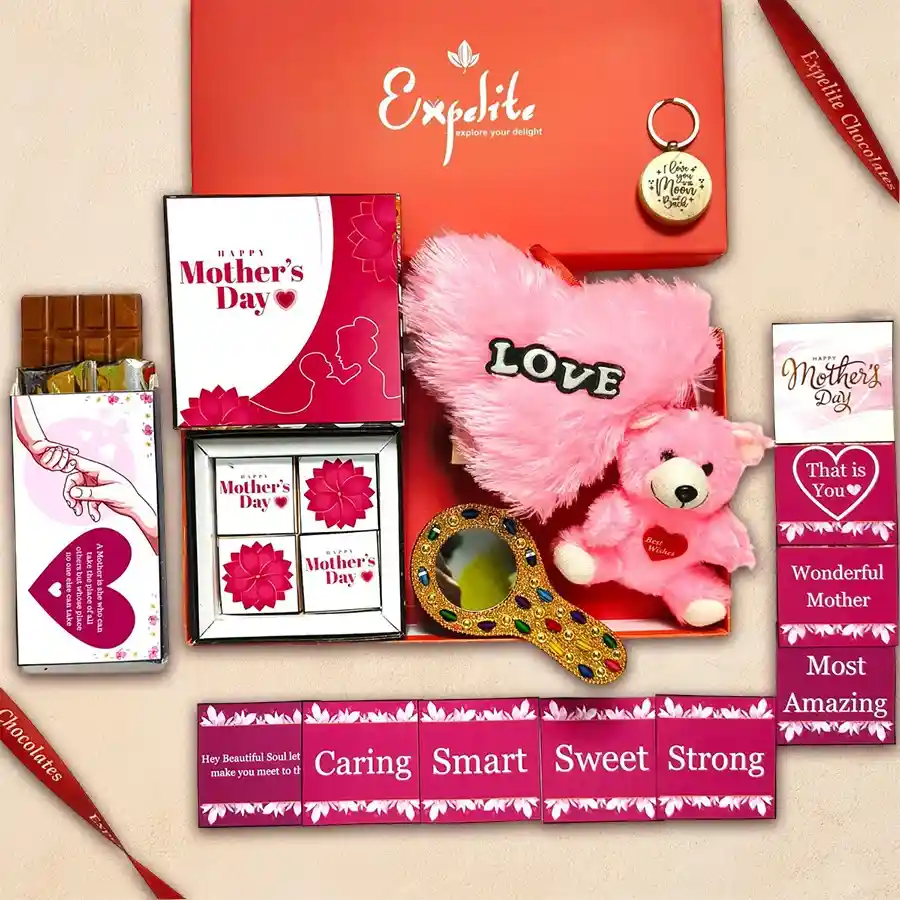 Deluxe Mother’s Day chocolates and gifts hamper featuring luxurious chocolates, a wooden keyring, heart-shaped pillow, teddy bear, stone-engraved mirror, chocolate bar, and greeting cards in a vibrant red box.