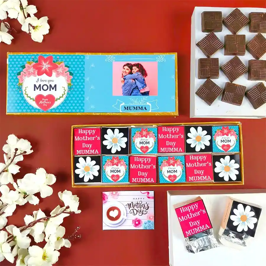 A beautifully designed gift box featuring 12 assorted personalized chocolates for Mother's Day, each with a name and photo, alongside a heartfelt greeting card.
