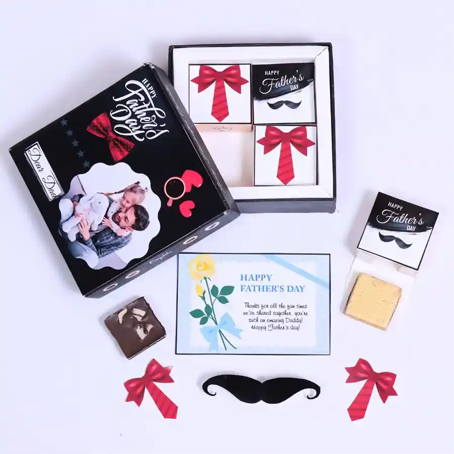 Custom chocolates in an elegant gift box for Father's Day, featuring personalized chocolates with a dad's name and photo, surrounded by a variety of flavors such as Roasted DryFruit, Cranberry, Paan, Butterscotch, Mix Fruits, and Chocochip.