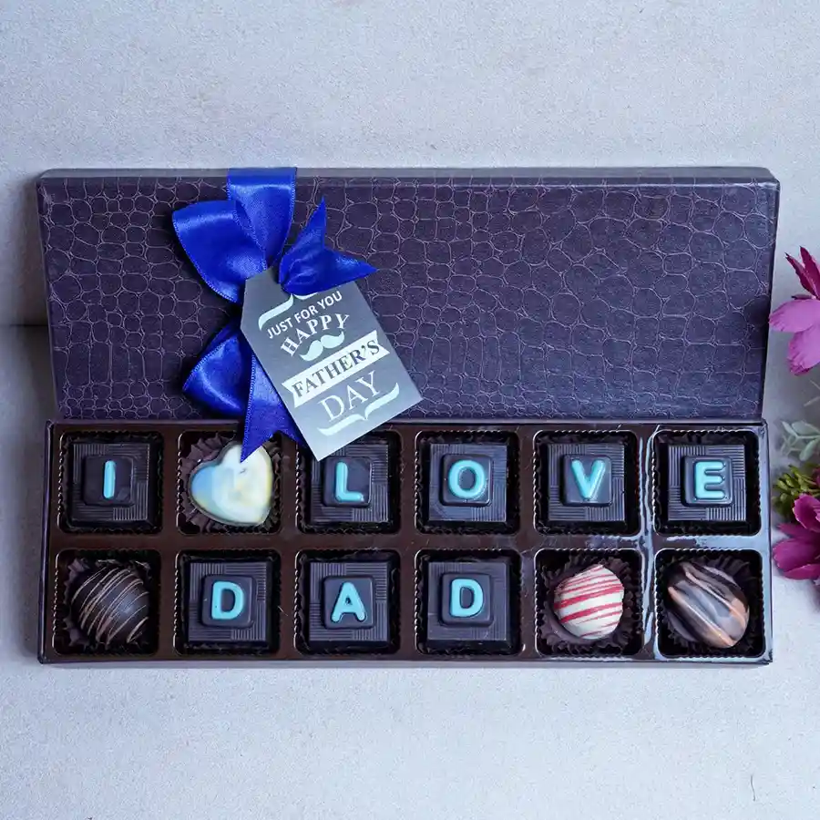 Indulgent Father's Day Chocolate Treat Box featuring Oreo chocolates, cranberry bites, orange crisps, truffles, and heart-shaped white chocolate