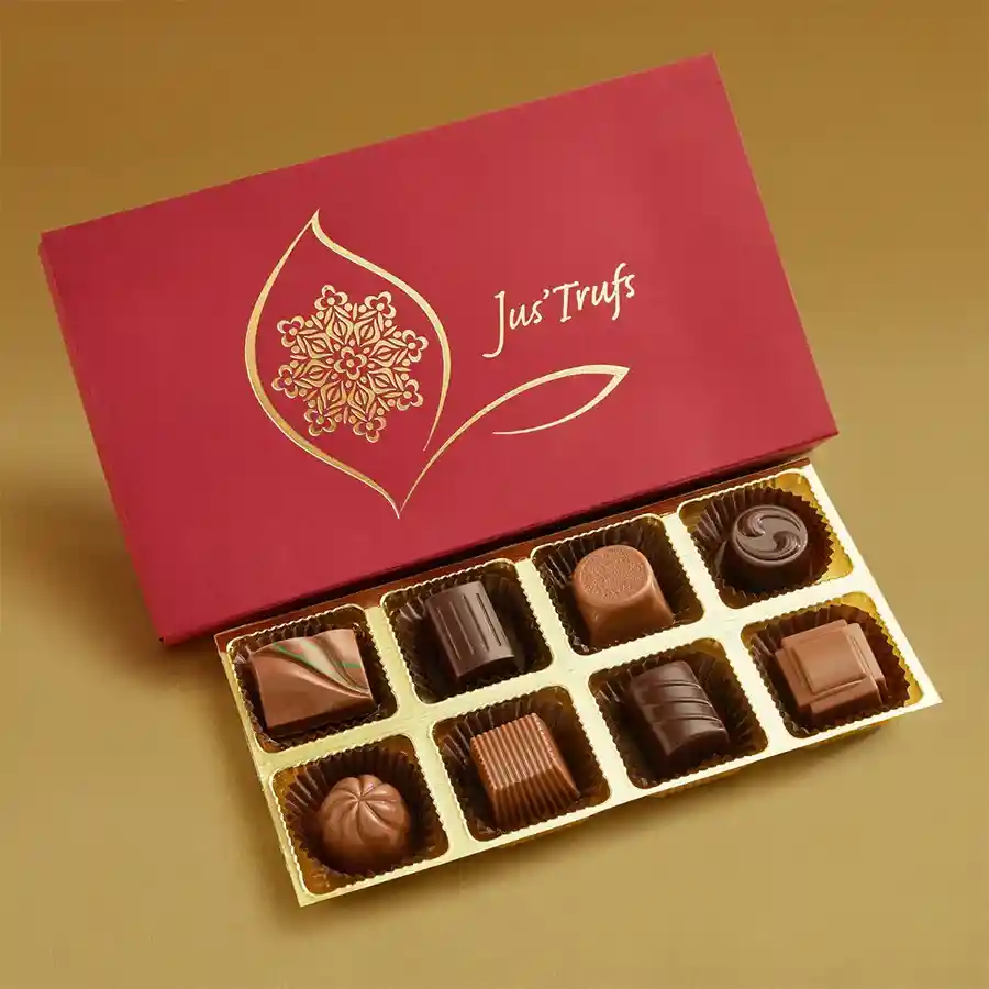 Festive Truffle Treasure Box with Mandala design, containing 8 assorted truffles in flavors like almond, mint surprise, and strawberry melody, placed on a decorative background.