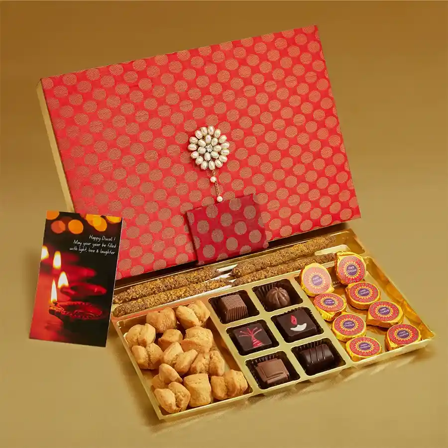 Choco Nut Diwali Celebration box featuring Chocolate Butterscotch Phooljadis, luxurious truffles in festive designs, crunchy Shakkar Pare, and beautifully crafted Jamin Chakkar chocolates in a brocade box.