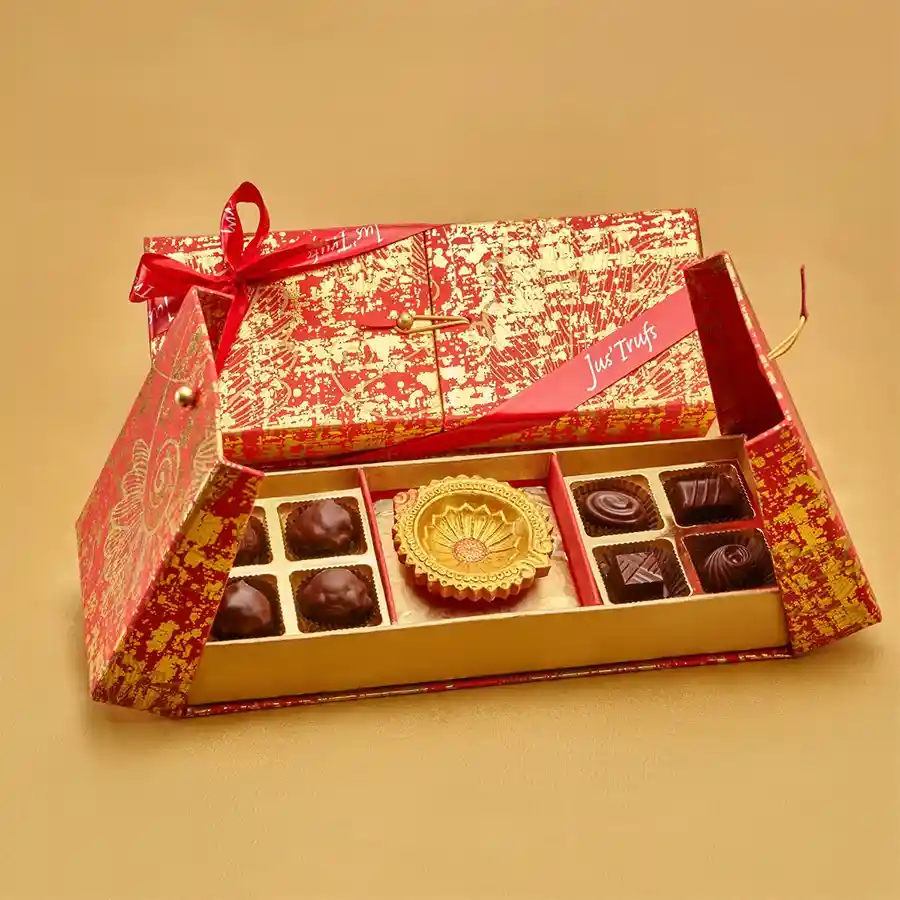 Dark Chocolate N Diyas Celebration Box featuring dark chocolate Zeal bites, assorted truffles and a decorative diya in a stylish wooden box.
