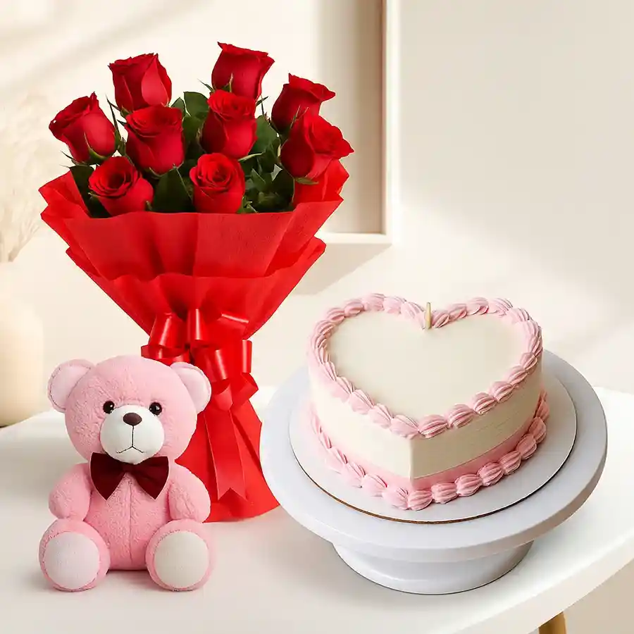Heart-shaped cake with teddy bear and Dutch roses in a vibrant gift combo.