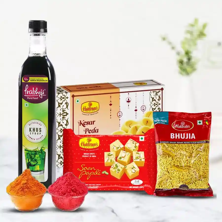 Heavenly Haldirams Gift Hamper featuring Khas Syrup, Kesar Peda, Soan Papdi, Bhujiya, and free herbal gulal, arranged beautifully for Holi celebrations.