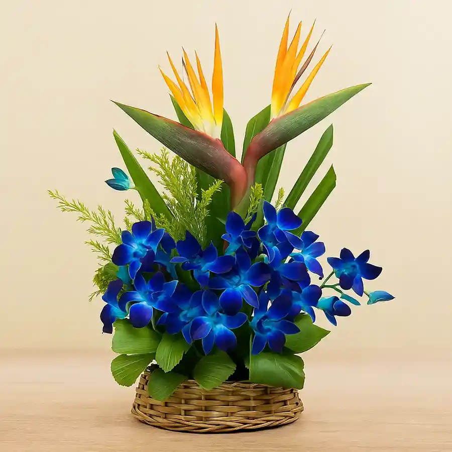 Exotic Bird of Paradise and blue orchids in a vibrant basket arrangement.