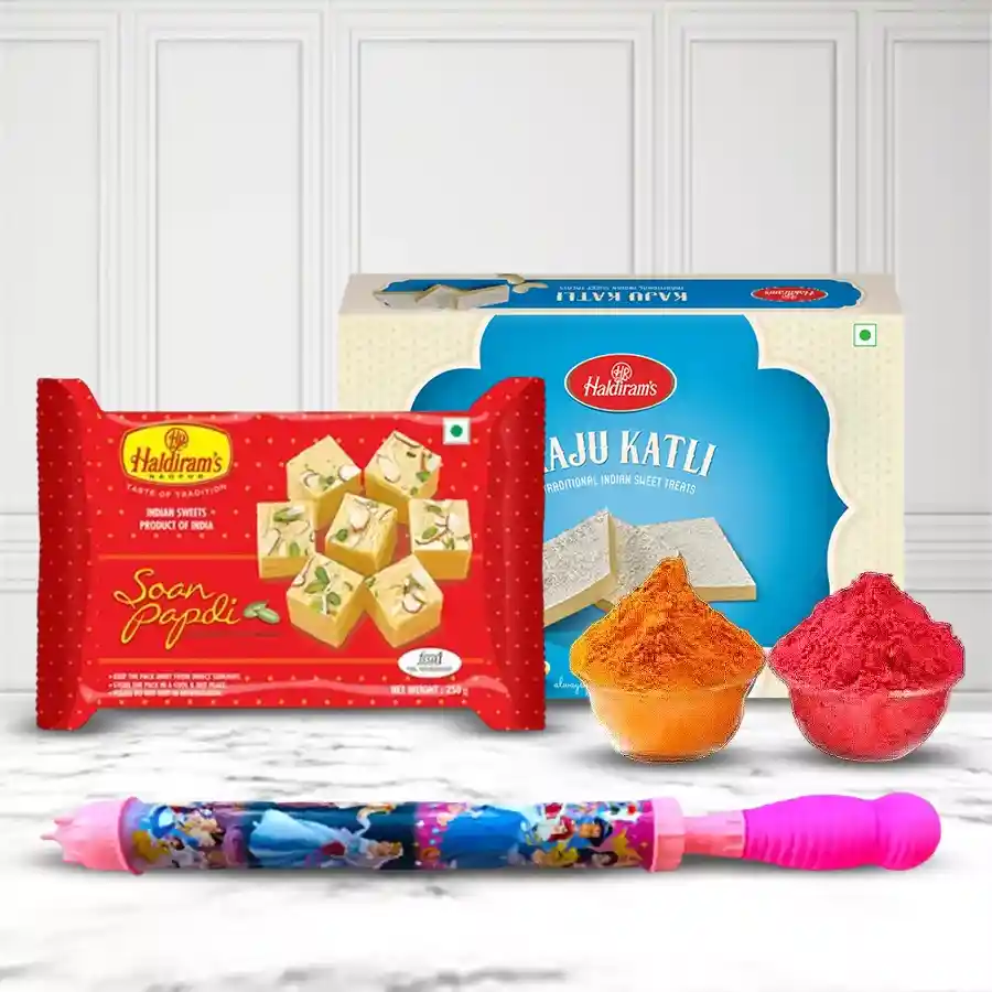Sapid Dalliance Gift from Haldiram featuring a Petite Pichkari Water Gun, Kaju Katli, Soan Papdi, and herbal Gulal for Holi celebrations