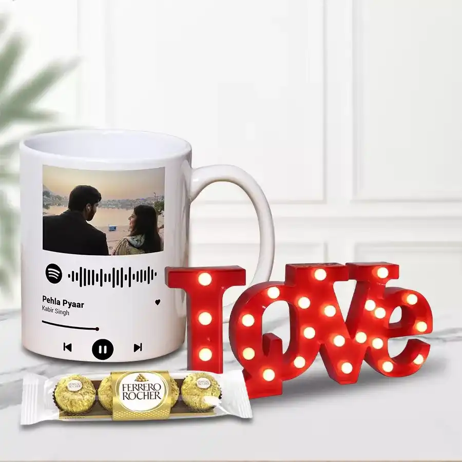 LOVE lamp, personalized photo coffee mug, and Ferrero Rocher chocolates arranged in a romantic gift package.