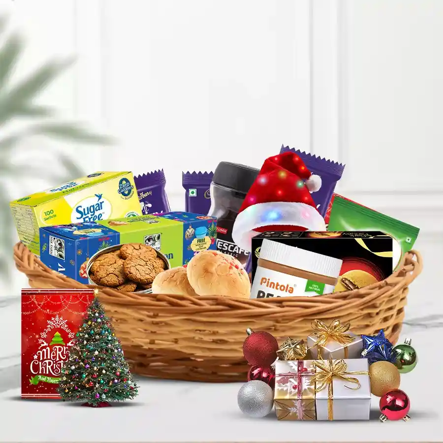 All in One Christmas Hamper filled with festive treats including fruit cake, chocolates, choco pies, coffee, peanut butter, sweet buns, decorations, a small Christmas tree, and a Santa LED cap.