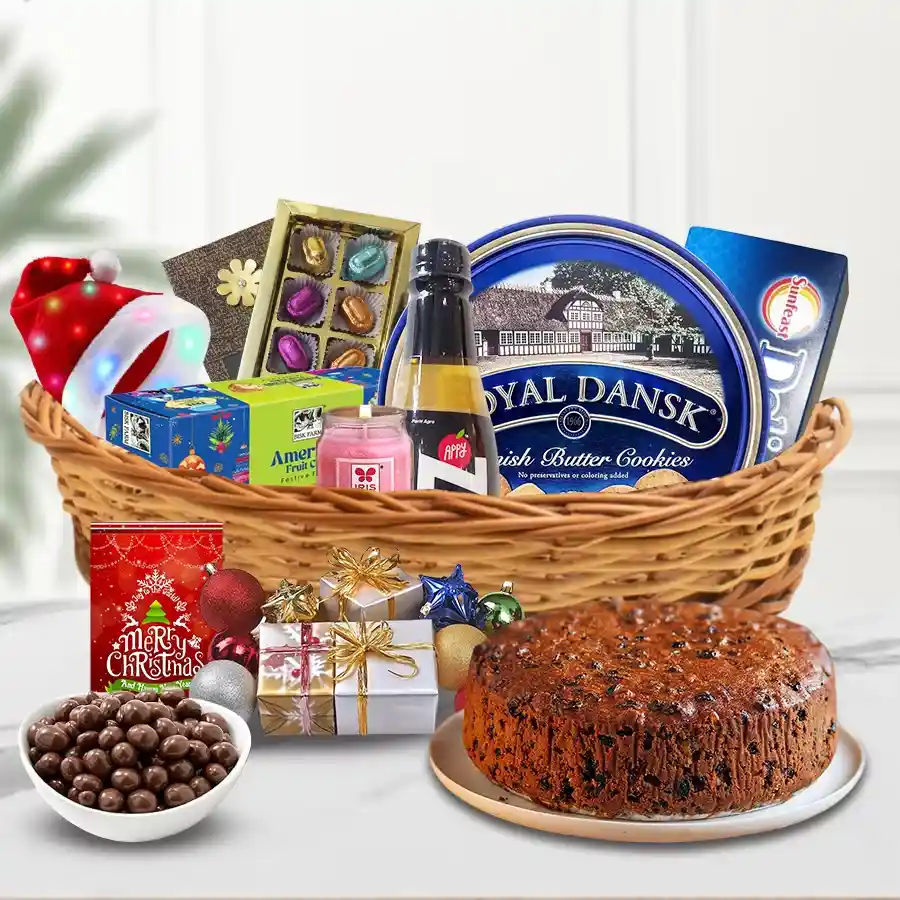 Santa at Your Door Step Christmas Hamper filled with festive treats, including fruit cake, chocolates, cookies, LED lights, scented candles, snacks, and decorations.