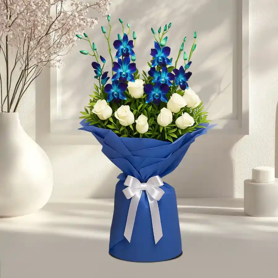 A beautiful bouquet featuring blue orchids and white roses, elegantly wrapped in tissue, perfect for gifting loved ones.
