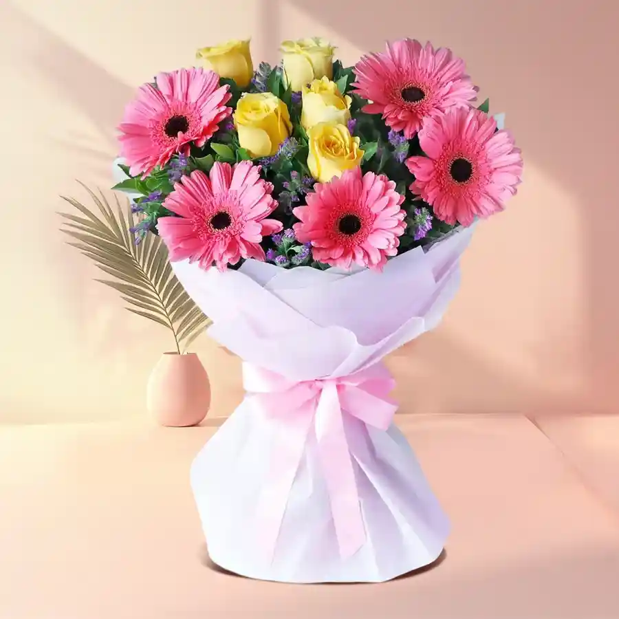 Tissue wrapped bouquet featuring 10 colorful gerberas and roses, perfect for gifting.