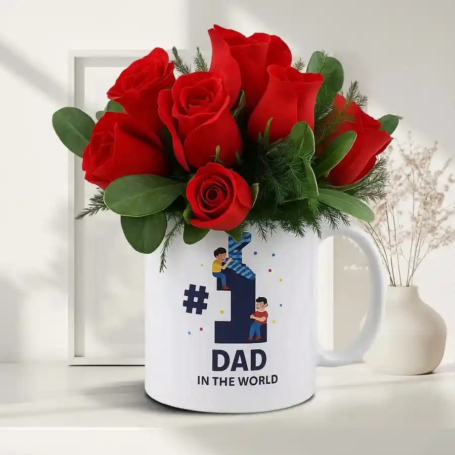 Gorgeous red roses in a bouquet next to a white ceramic mug saying "No. 1 Dad in the World."