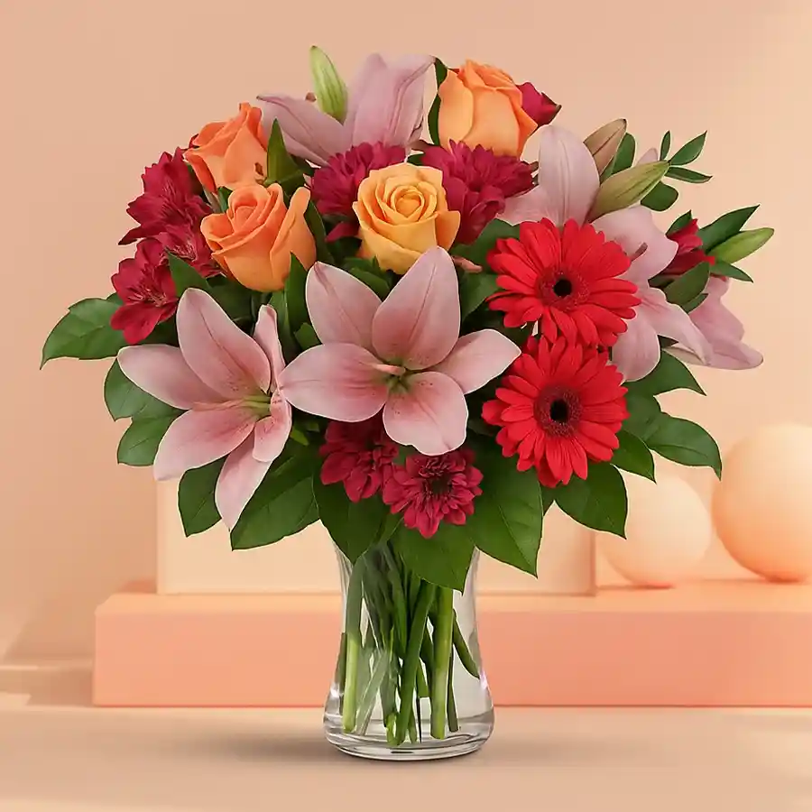 Wishful Floral Vase with pink gerberas, yellow roses, and pink lilies.