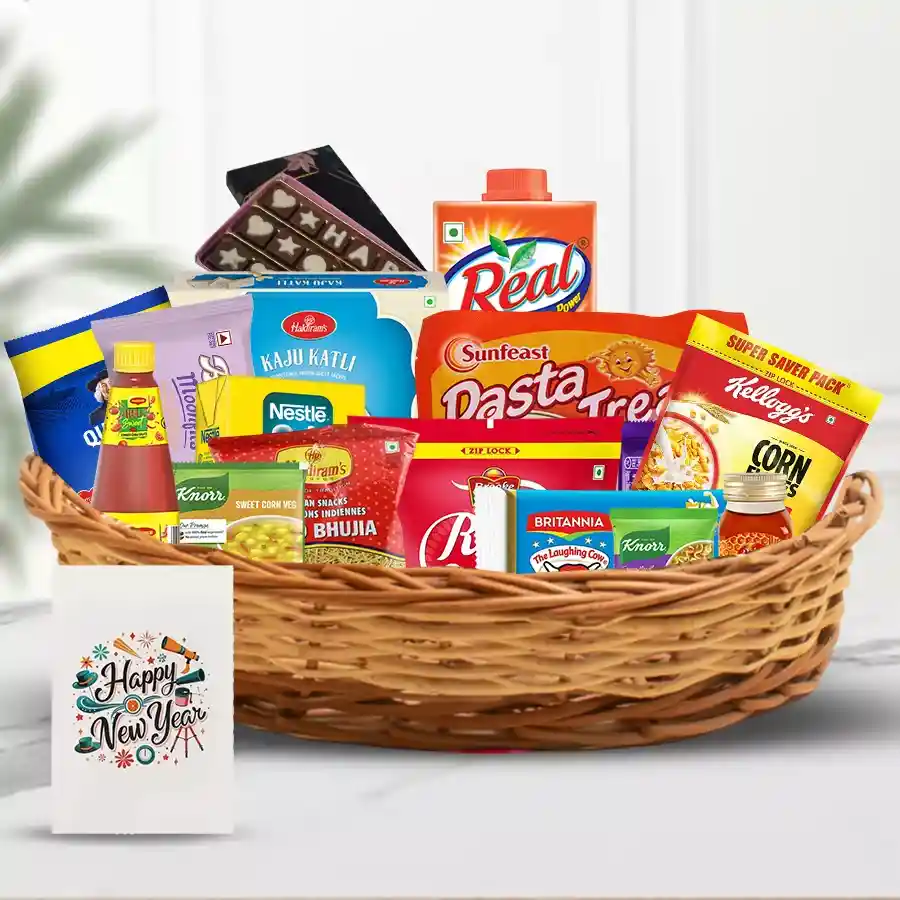 A beautifully arranged Cheers Abound New Year Hamper filled with Nestle Slim Milk, Brooke Bond Red Label Tea, Britannia goodies, Kellogg’s Corn Flakes, Quaker Oats, Haldirams snacks, Maggi sauces, real mango juice, Happy New Year chocolates, and a greeting card in a charming basket.