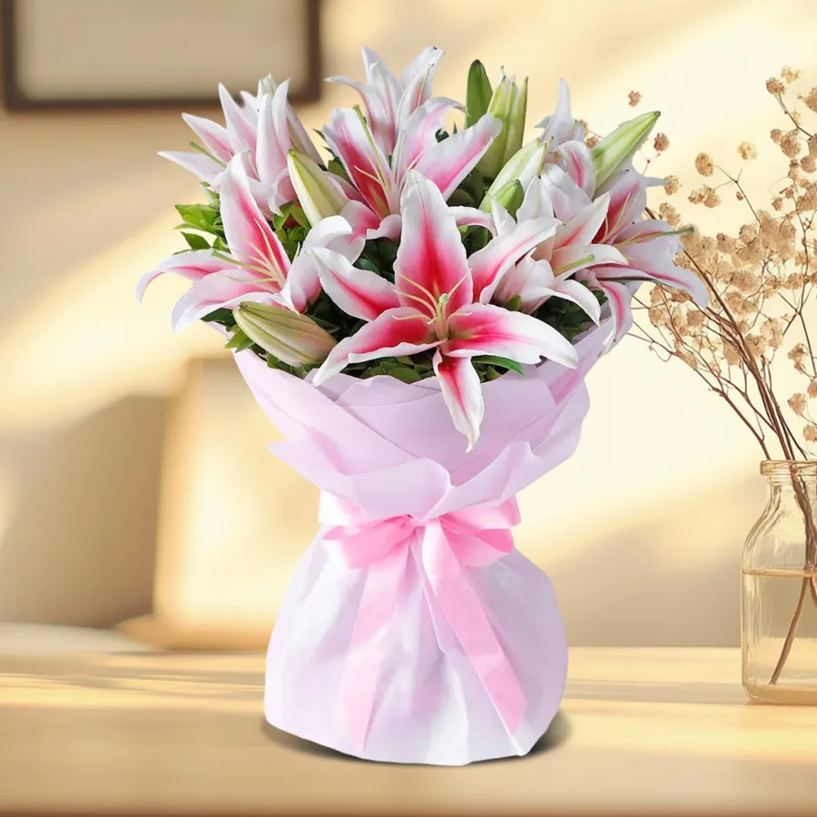 Stunning bouquet of 8 Pink Oriental Lilies wrapped in tissue, exuding elegance and charm.