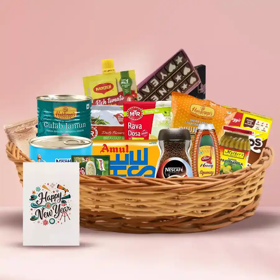 A beautifully arranged festive gift hamper filled with delicious treats, including Amul Cheese Slices, Nestle Milkmaid, Nescafe Classic Coffee, Dabur Honey, Kellogg’s Chocos, Quaker Oats, MTR Poha, Haldirams Namkeen, Gulab Jamun, Mothers Recipe Pickle, Knorr Cup-a-Soup, Maggi Ketchup, and Happy New Year Chocolates, topped with a cheerful greetings card.