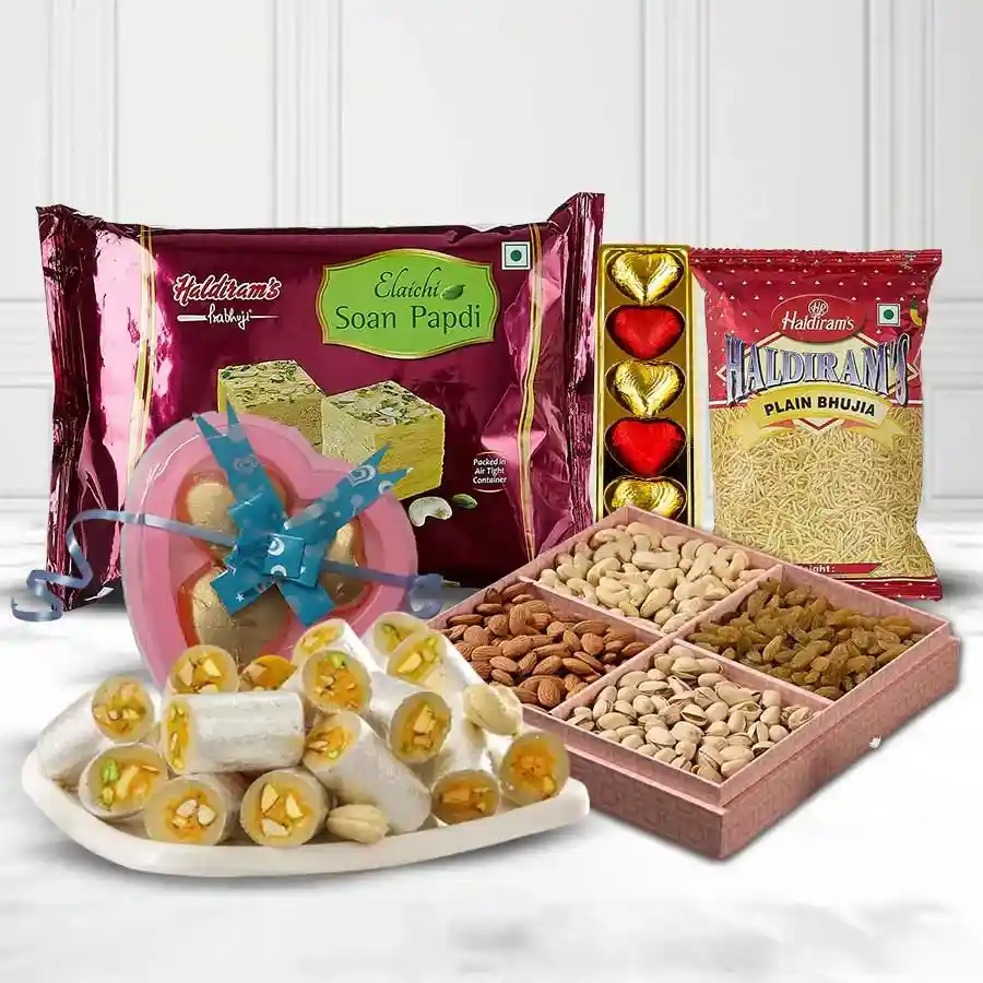 Delicious Chocolates Assortments Gift Hamper featuring Haldirams Soan Papdi, Bhujia, Kaju Pista Rolls, assorted dry fruits, homemade chocolates, and heart-shaped treats.