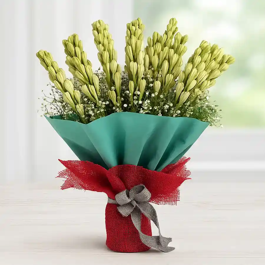 Exquisite hand bouquet of 12 tuberoses wrapped in elegant tissue.