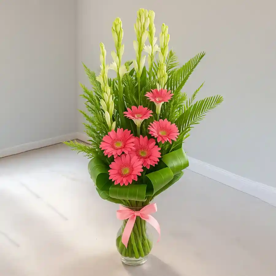 A vibrant bouquet of 16 Gerberas and Rajnigandha, ideal for Sweet 16 celebrations.