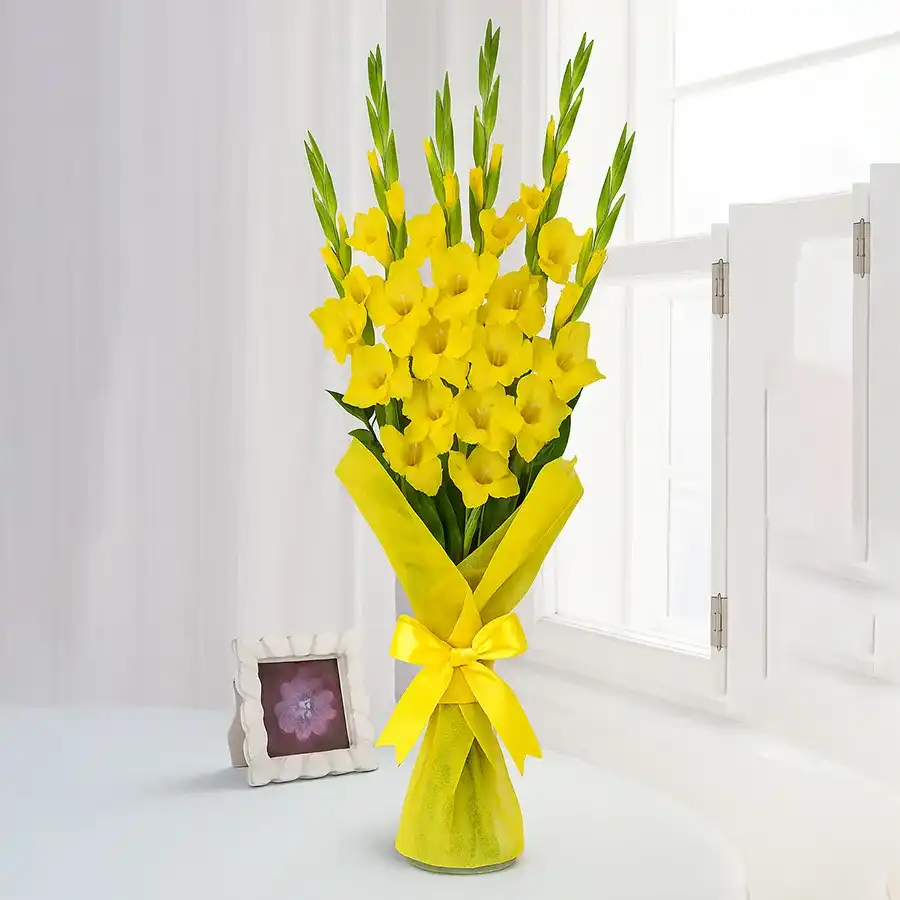 A vibrant bouquet featuring 10 yellow gladiolus and 10 yellow roses, symbolizing warmth and affection.