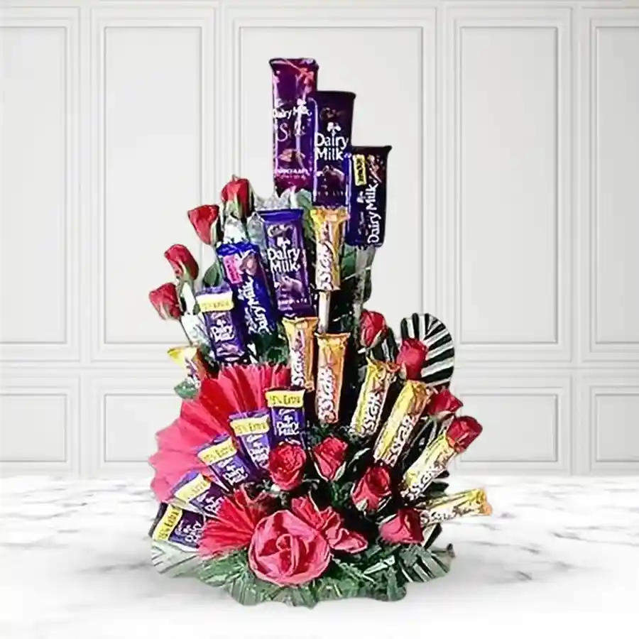 A bouquet of 12 red roses alongside 20 Cadbury chocolates, ideal for expressing love and affection.