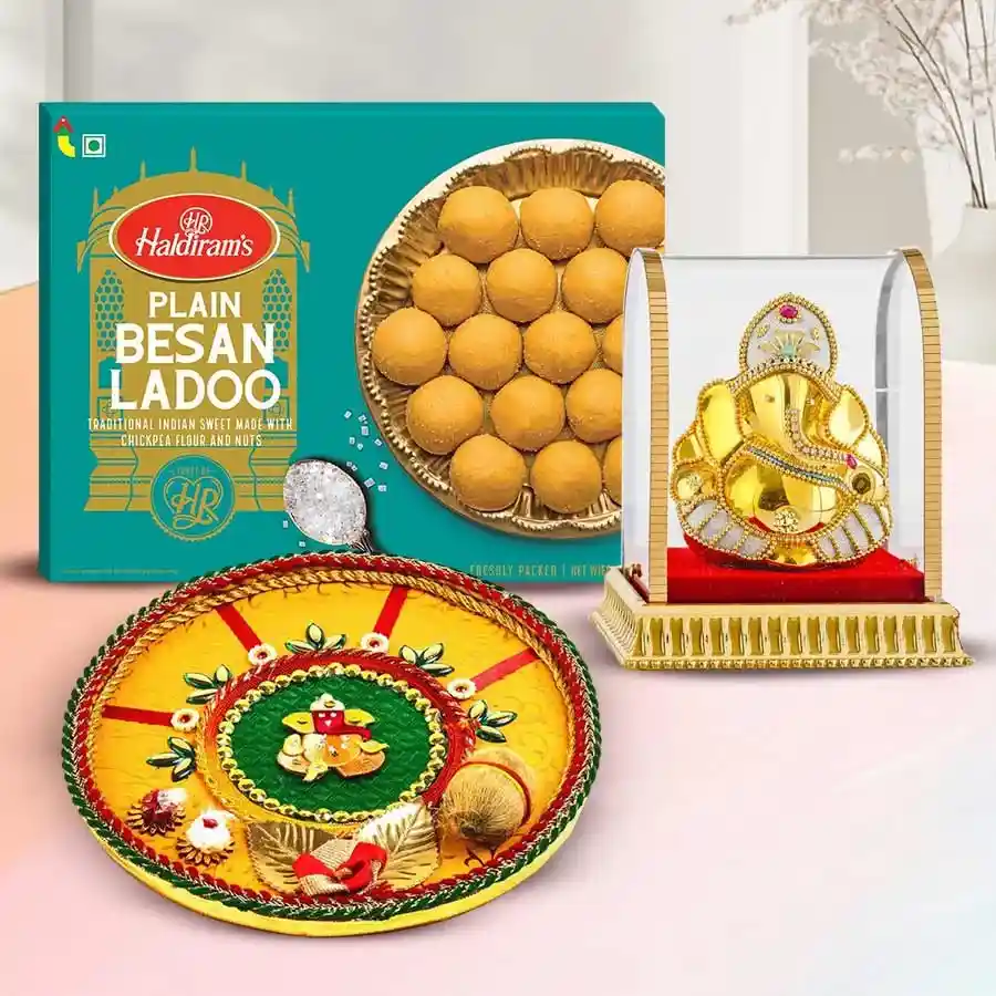 Devotion to Prudence Set for Ganesh Chaturthi featuring a Ganesh figurine, Haldirams Besan Laddoos, and a Shree Puja Thali