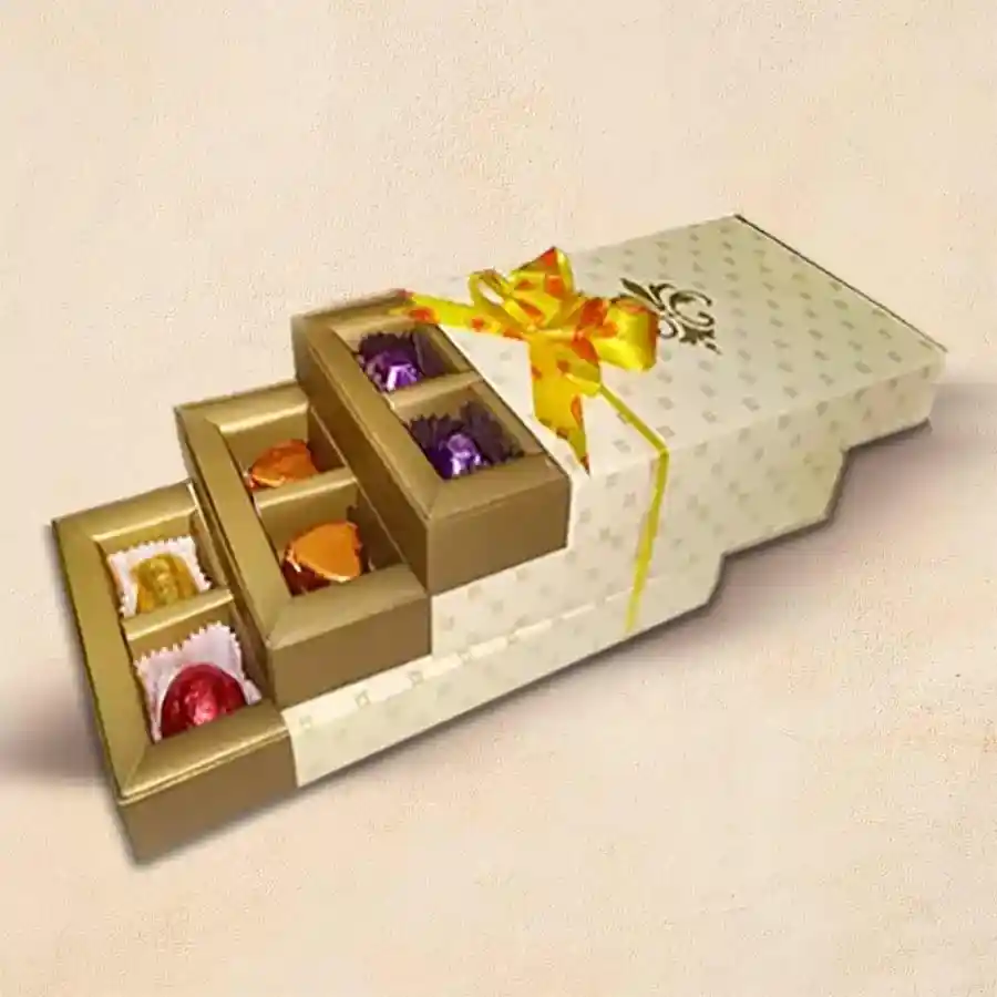 Three-layered drawer filled with 24 handcrafted Valentine chocolates, featuring a variety of artisanal treats in a romantic presentation.