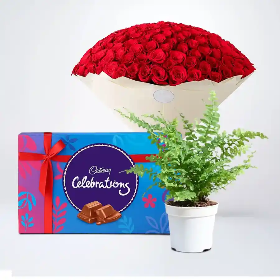 Bouquet of red roses with Bostern fern and Cadbury chocolates.