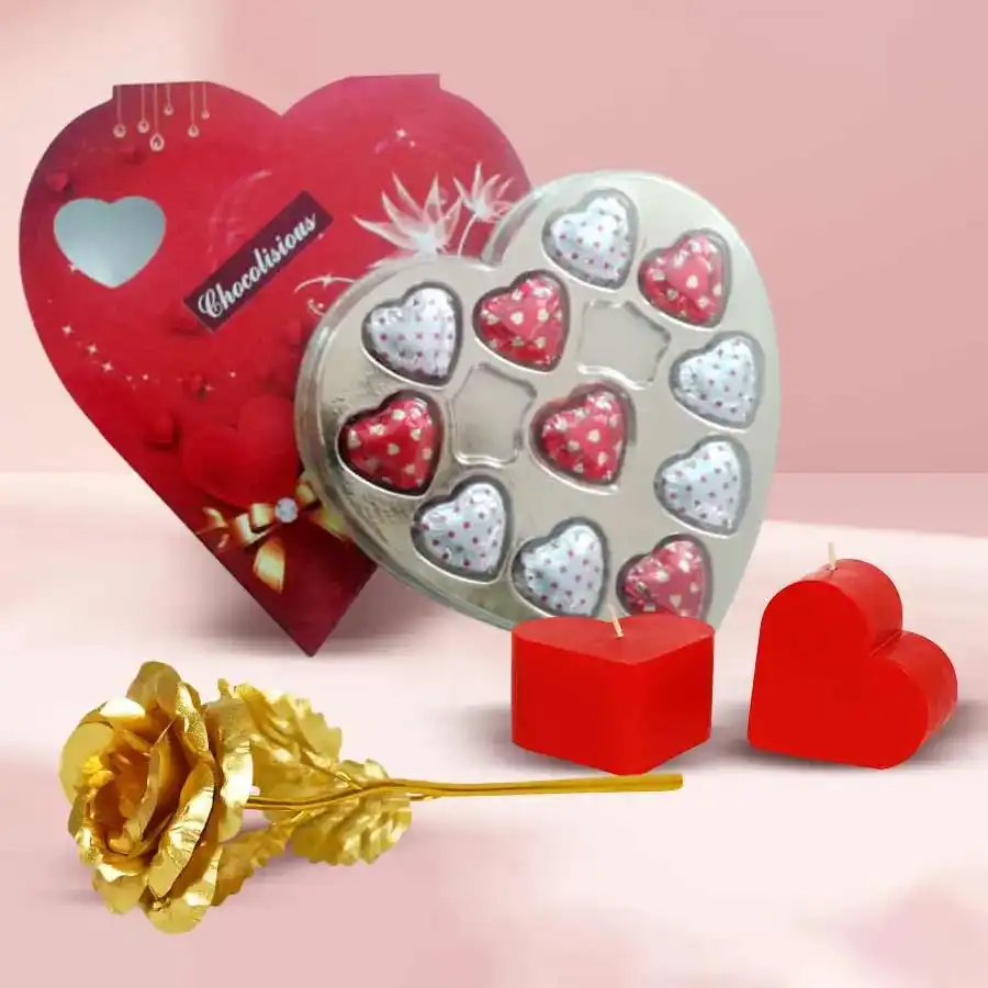 Valentine's Day gift assortment featuring heart-shaped chocolates, a golden rose, and romantic love candles
