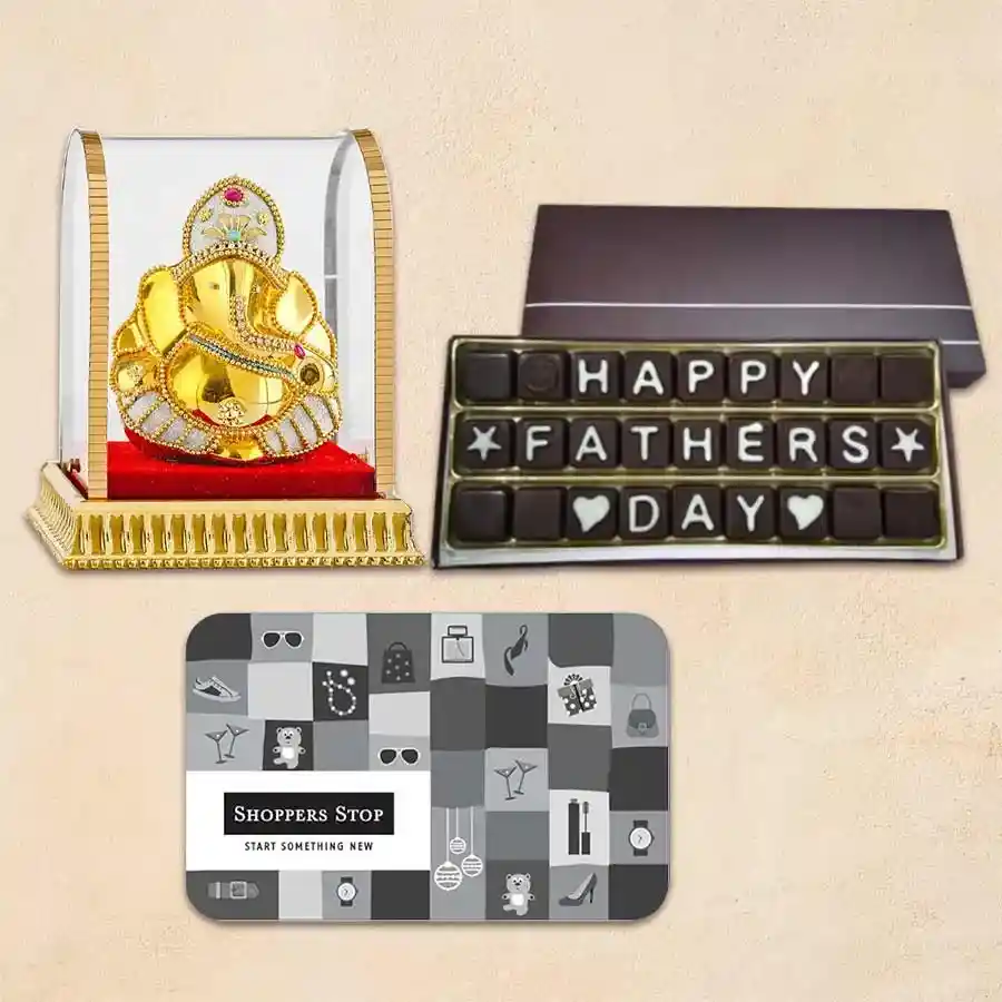 Father’s Day gift set including chocolates, a ₹1000 Dinner E-Voucher from Shoppers Stop, and a Lucky Ganesh Idol.