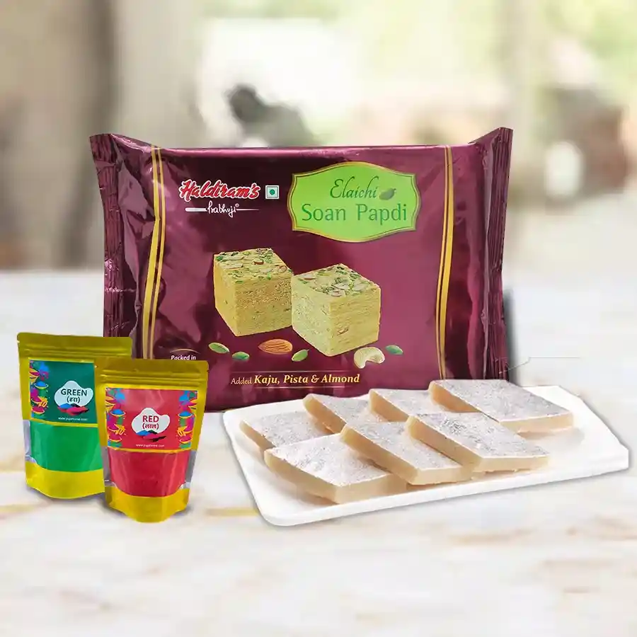 Holi Delight gift set featuring Haldiram Soan Papdi, Kaju Katli, and a pack of eco-friendly Herbal Gulal