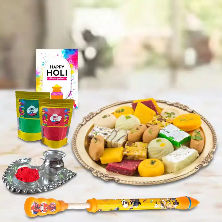 Holi Essentials Gift Hamper featuring colorful pichkaris, herbal gulal, a Holi card, assorted sweets, and a silver-plated aarti thali