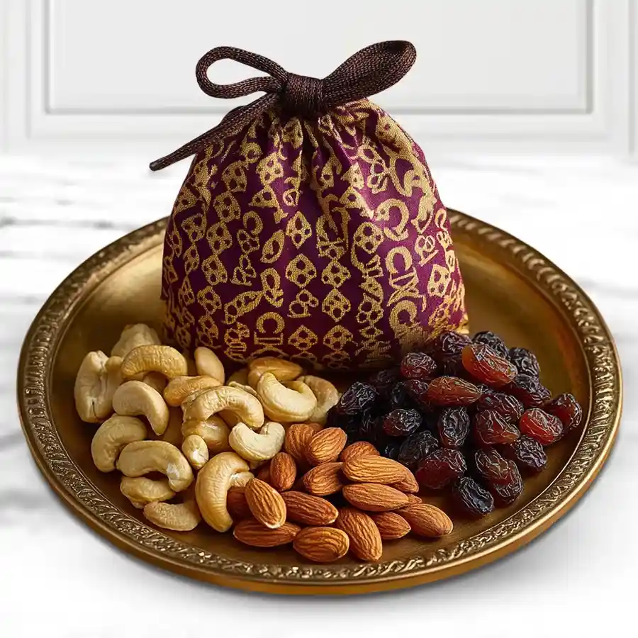 Tasty Mixed Dry Fruits Potli with Fancy Golden Plated Thali showcasing almonds, cashews, and raisins