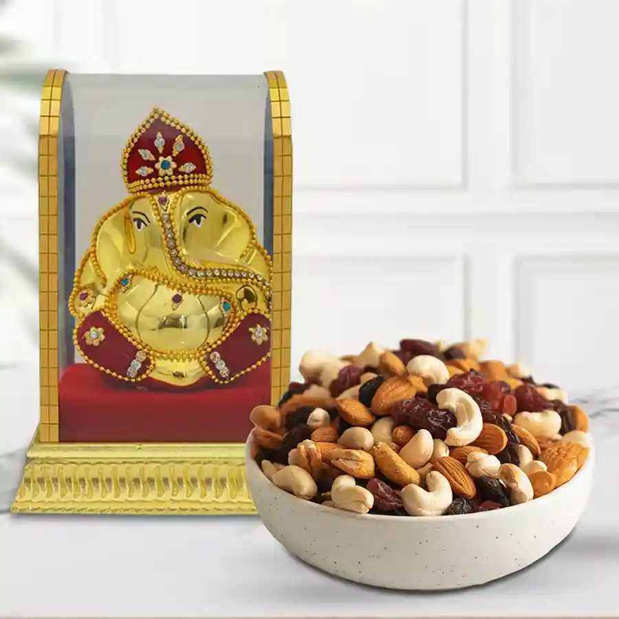 Mixed Dry Fruits Potli alongside a Lord Vinayak idol, presenting a festive gift arrangement for Mother's Day.