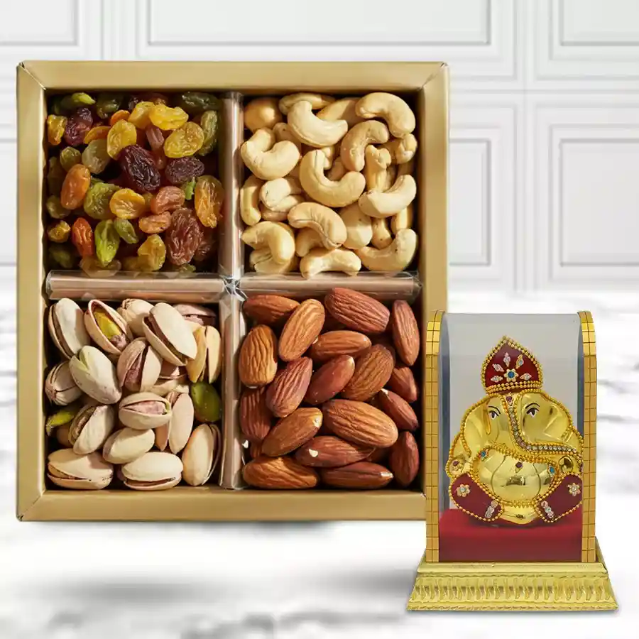 Mixed dry fruits box with Ganesh Murti, featuring salted pista, sweet raisins, crunchy cashews, and almonds.