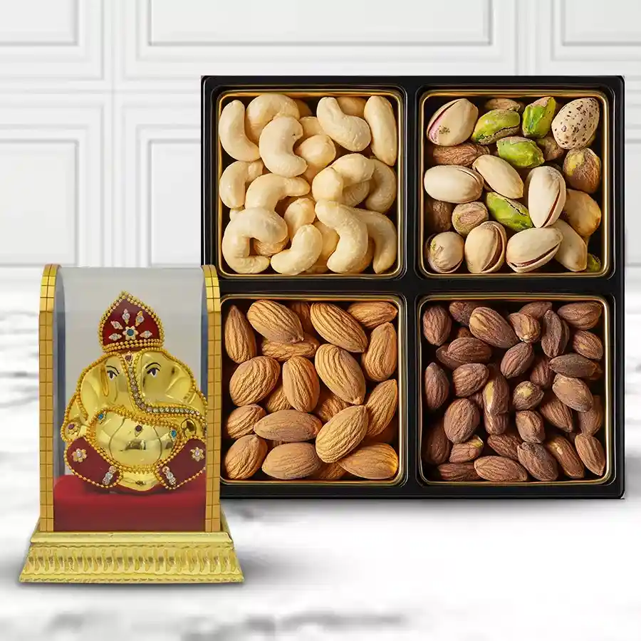Exclusive Lord Vinayaka Murti alongside a Mixed Dry Fruits Box containing raisins, almonds, cashews, and salted pistas.