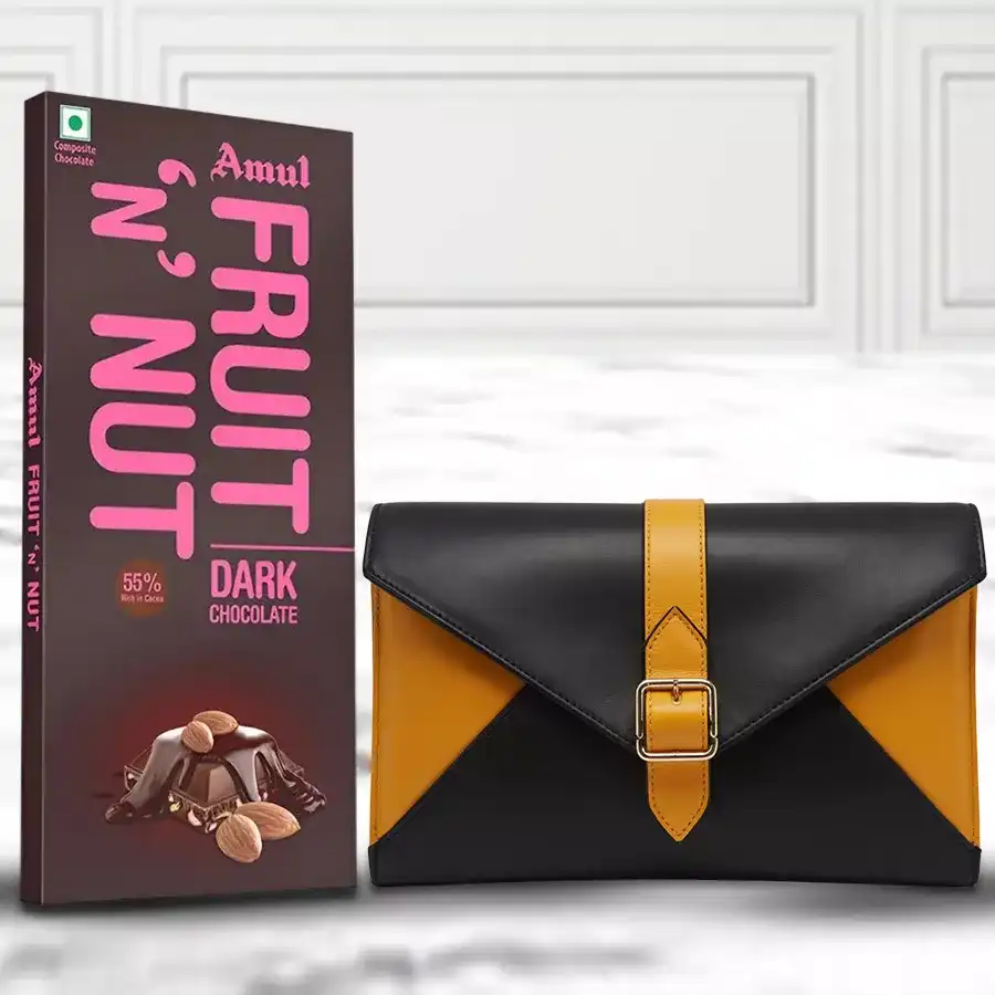Yellow and black ladies clutch with an Amul chocolate bar placed beside it.