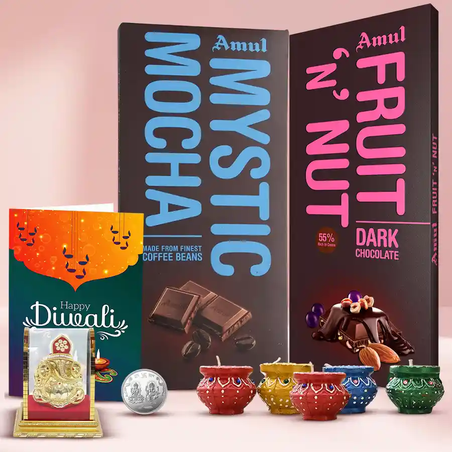 Tasty Amul Chocolate Bars, Vighnesh Murti, decorative diyas, Diwali greetings card, and a silver-plated Lakshmi Ganesh coin arranged in a festive gift box.