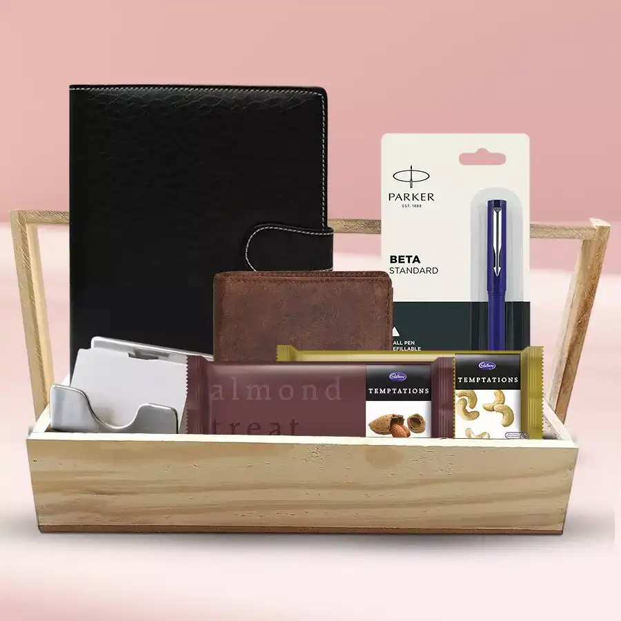 Exclusive Gift Hamper featuring Cadbury Temptation Rum N Rasin, Almonds, a Planner Diary, Parker Beta Pen, Visiting Card Holder, Rich Born Wallet, and Wooden Tray arranged elegantly.