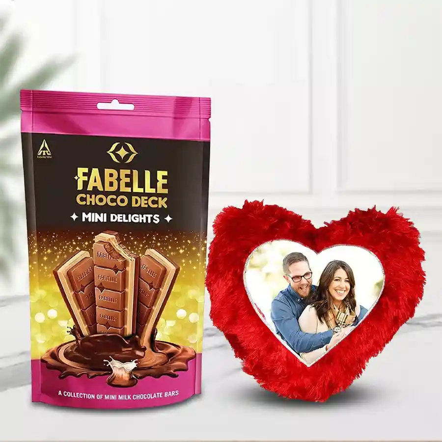 ITC Fabelle Mini Delight Chocolates with a personalized heart-shaped cushion on a decorative background