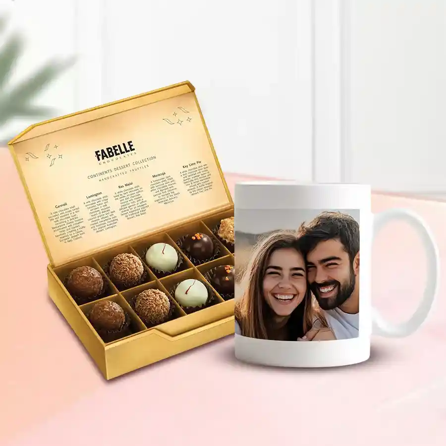 Stylish personalized coffee mug next to a box of 10 ITC premium chocolates